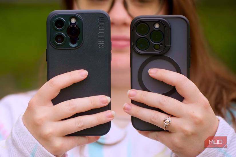 A woman holding two iPhones showing their cameras
