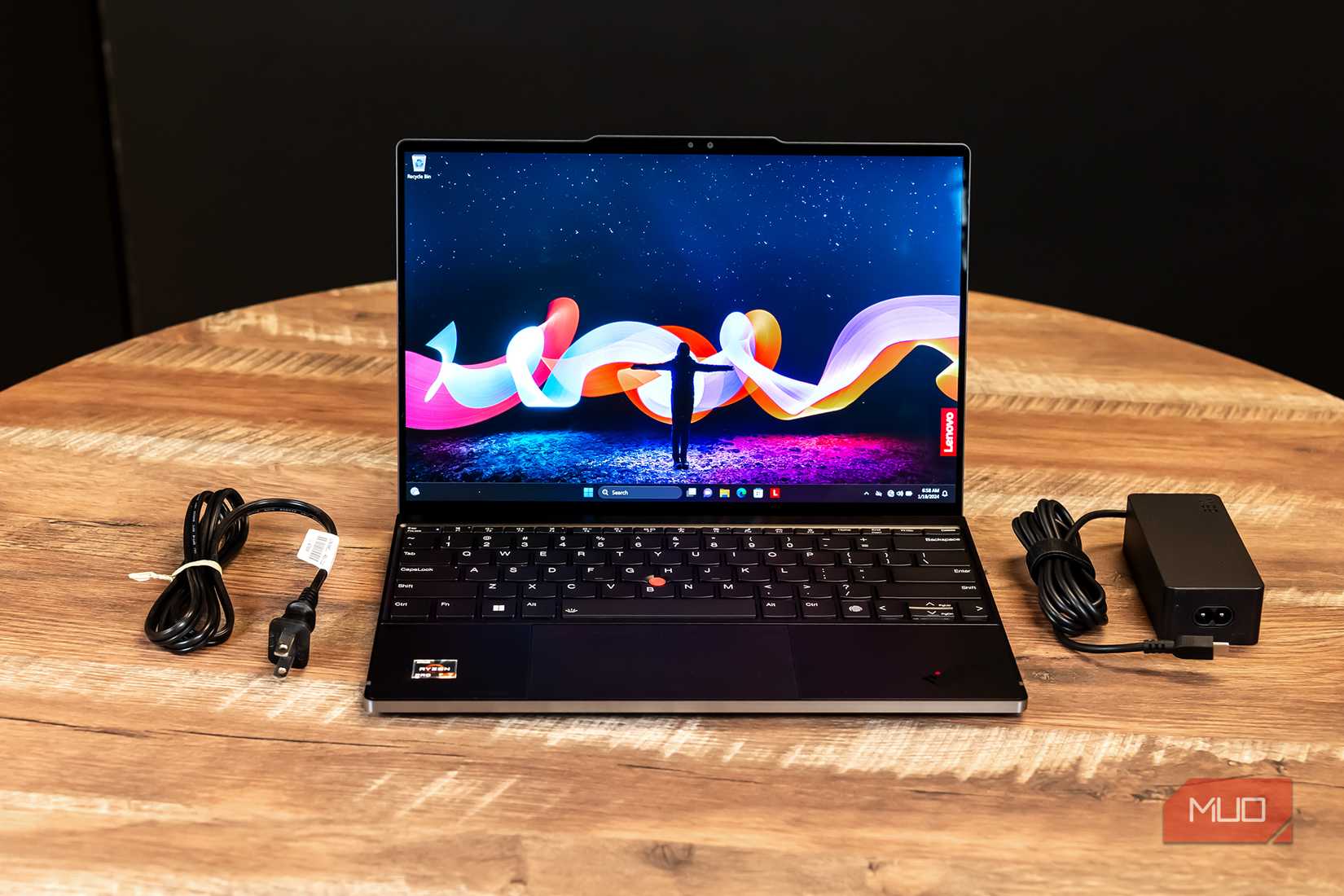 The Lenovo Z13 Gen 2 with its charger