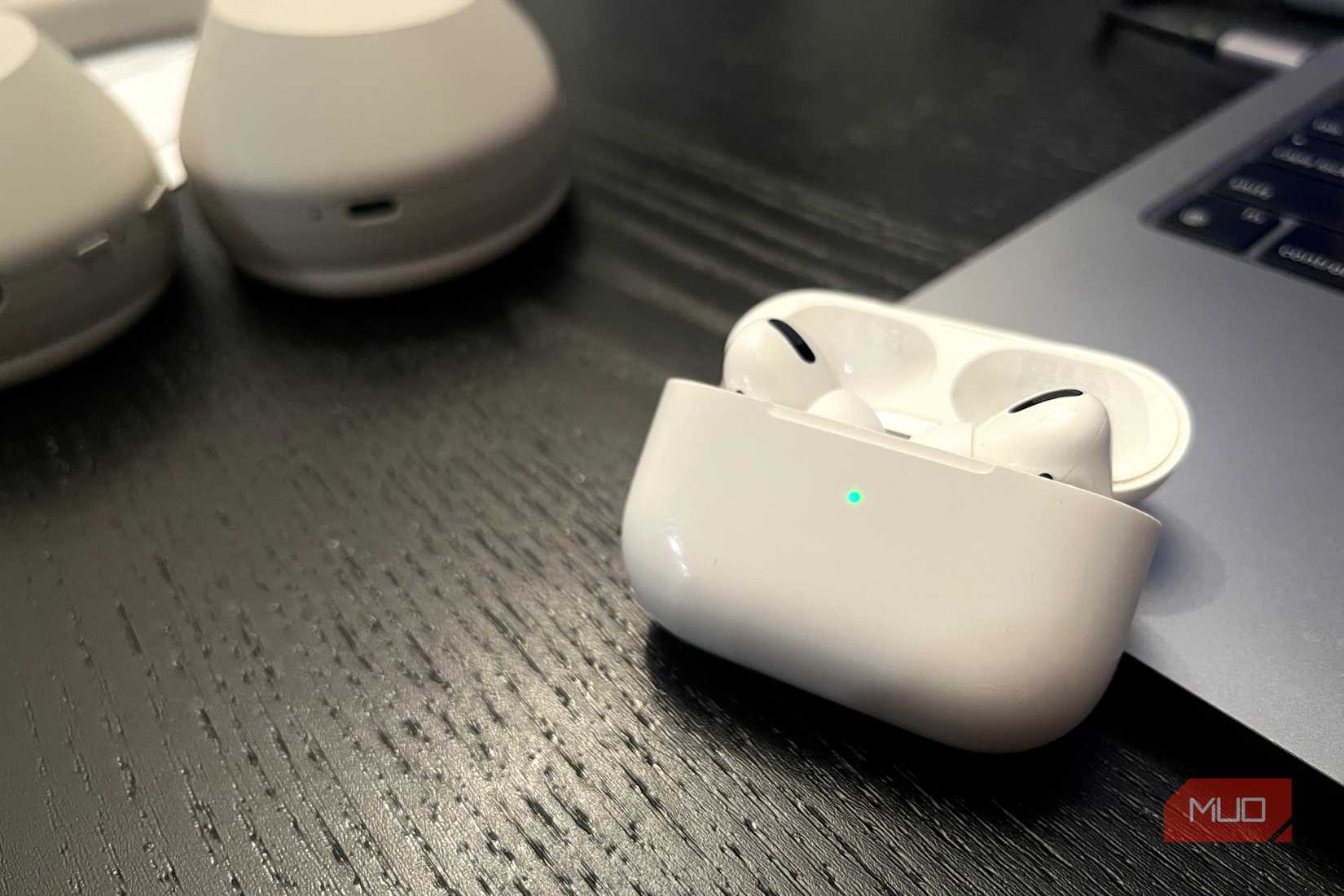 AirPods Pro case open with a green status light
