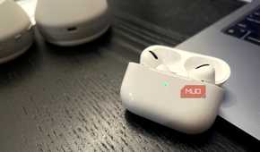 AirPods Pro case open with a green status light