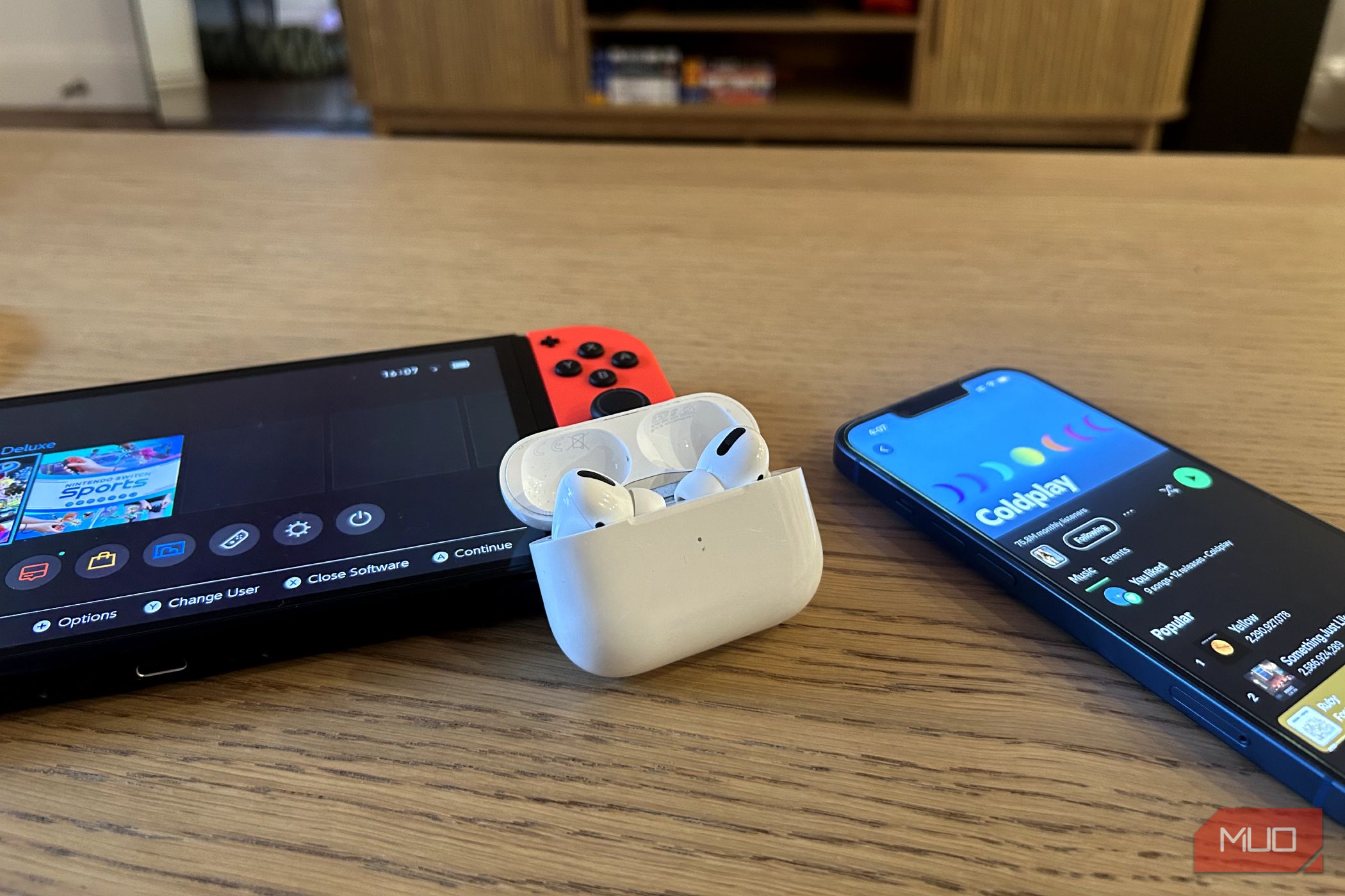 AirPods Pro with an iPhone and a Nintendo Switch in the background
