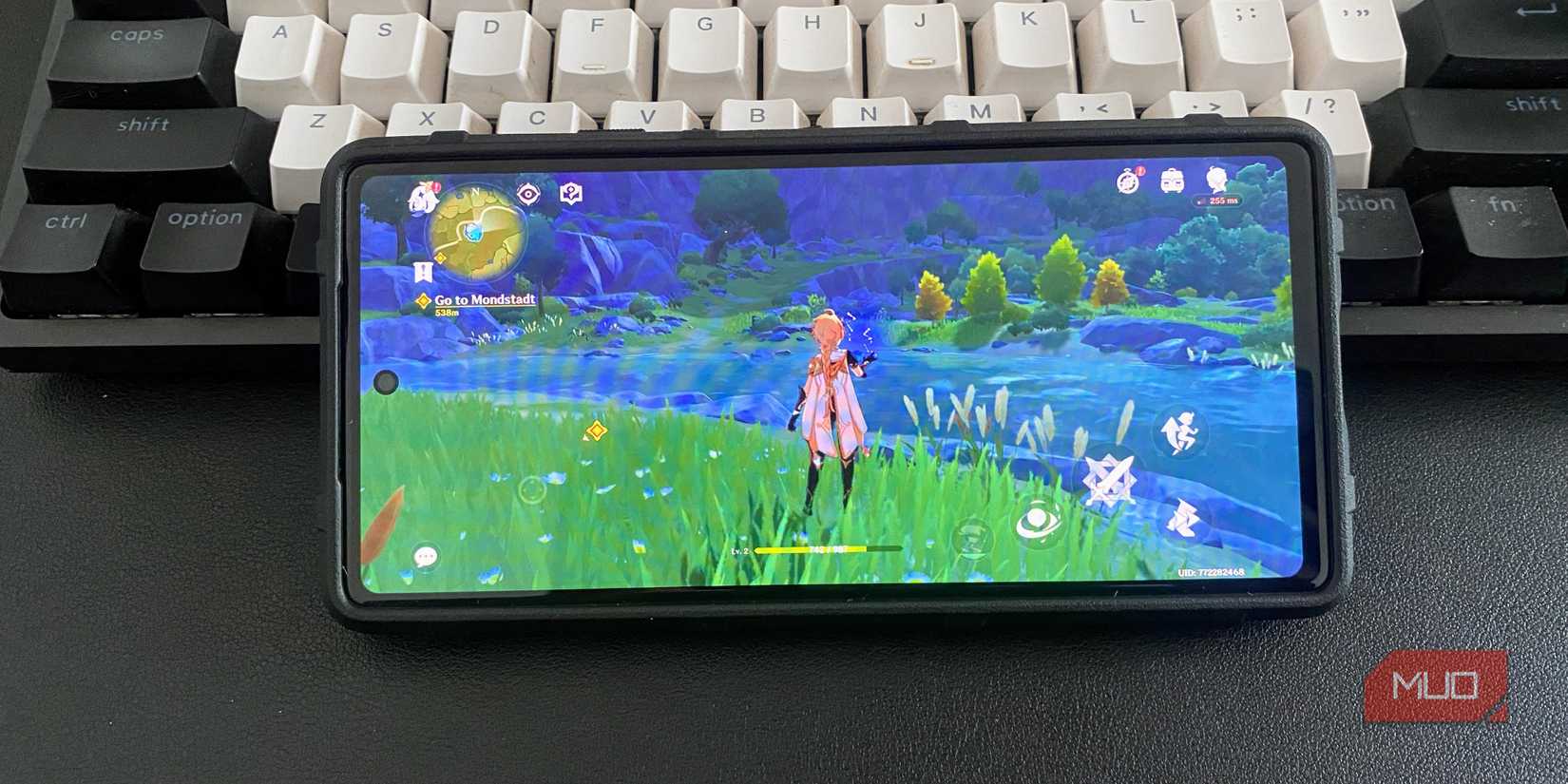 Playing Genshin Impact RPG game on an Android phone