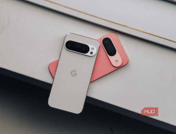 Pixel 9 in pink and 9 Pro in white on white ledge (head on)