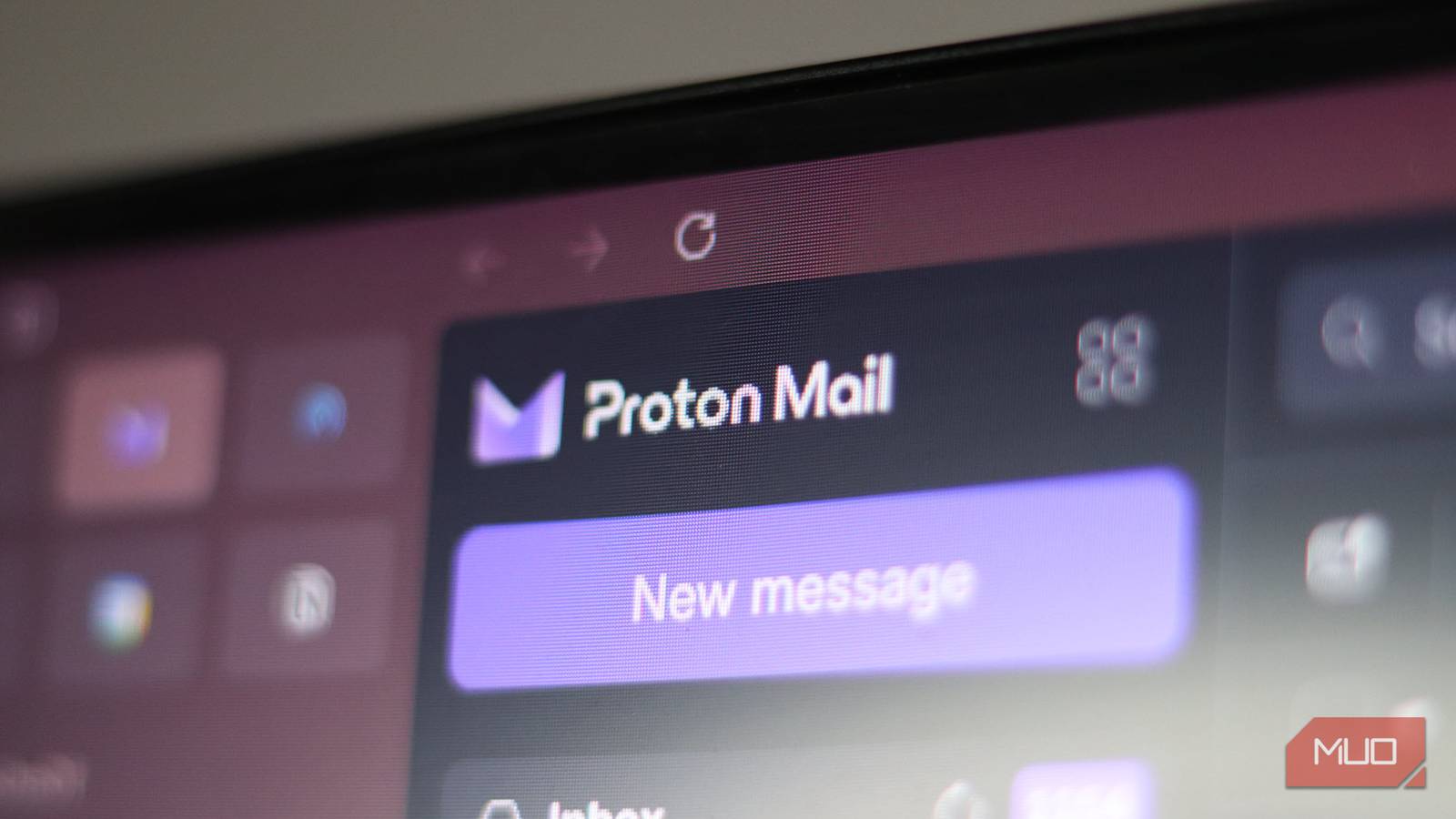 Monitor showing the Proton Mail logo