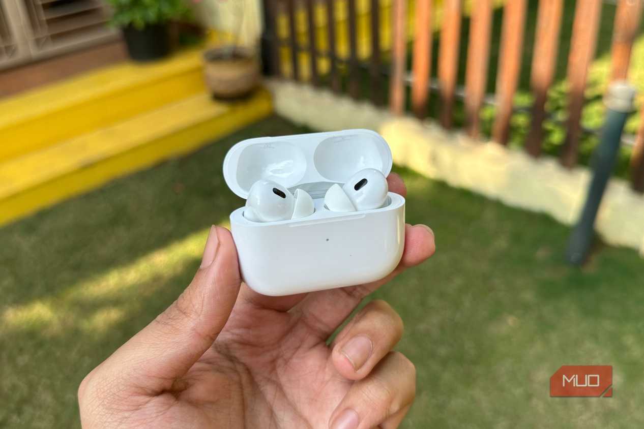 AirPods Pro 2 with case open being held in a man's hand