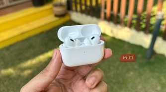 AirPods Pro 2 with case open being held in a man's hand