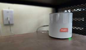 TP-Link Deco mesh Wi-Fi node on a shelf.