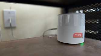 TP-Link Deco mesh Wi-Fi node on a shelf.