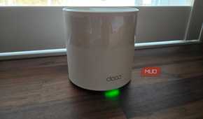 TP-Link Deco mesh Wi-Fi node on a desk.