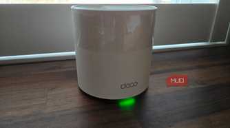 TP-Link Deco mesh Wi-Fi node on a desk.