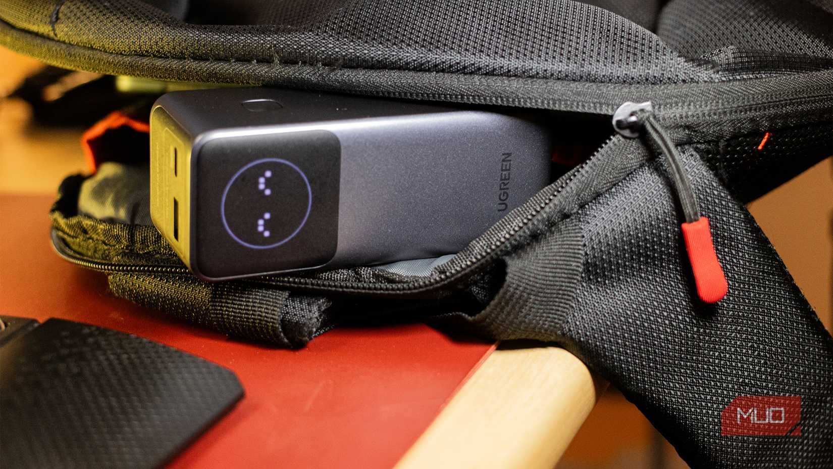 Ugreen Nexode 12000mAh Power Bank in a backpack.