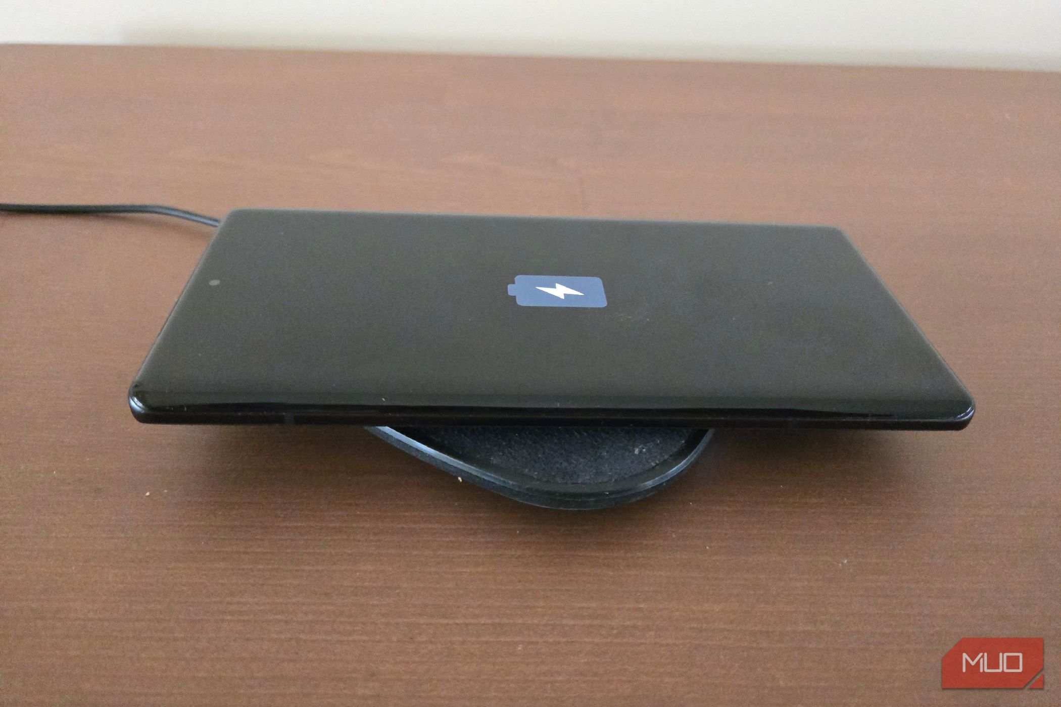 Motorola Edge Plus 2023 on a wireless charging pad.