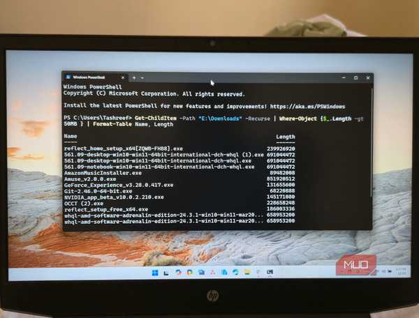 HP Pavilion Laptop on a Bed with PowerShell open on the display