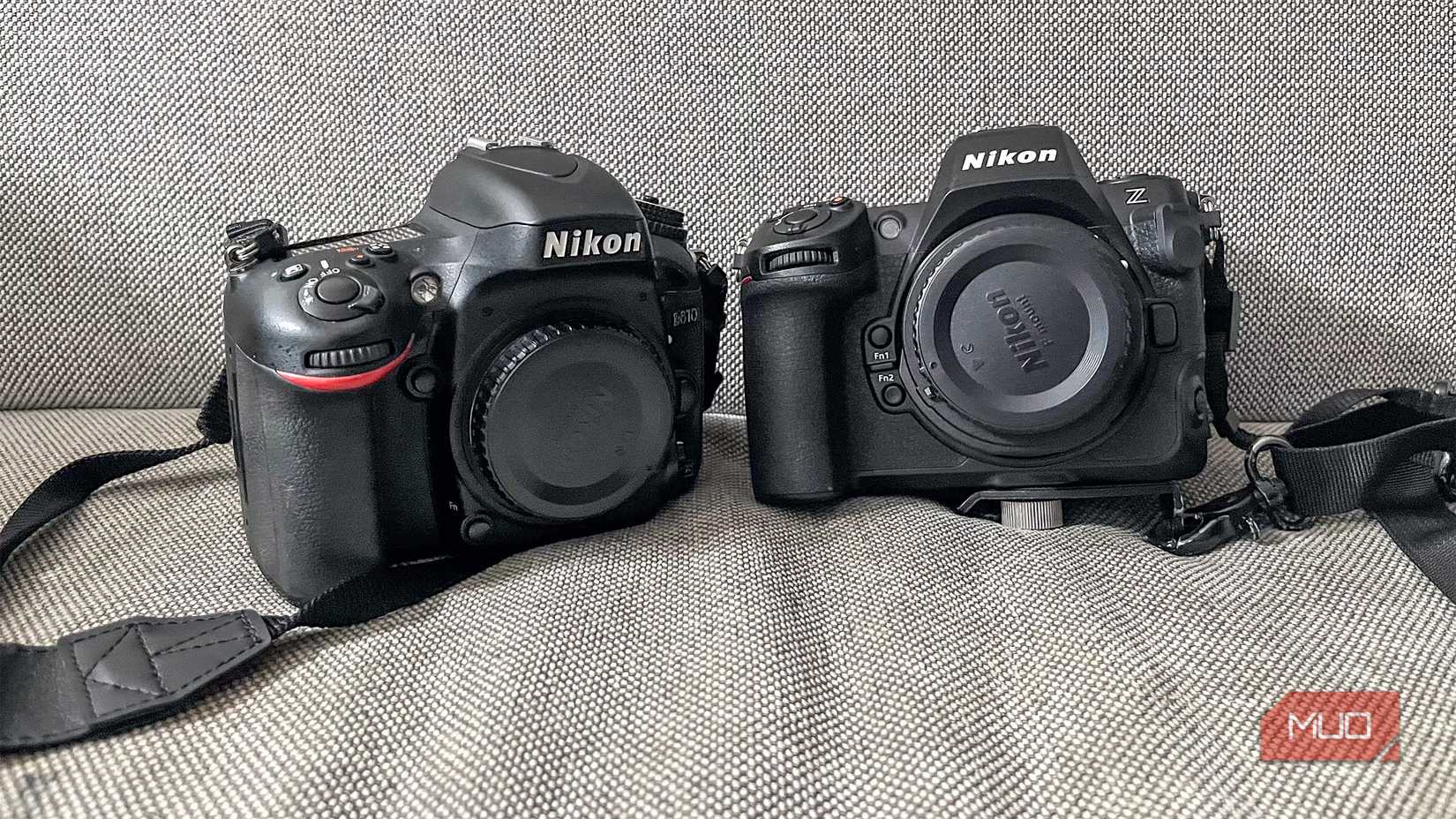 A mirrorless and DSLR camera next to each other