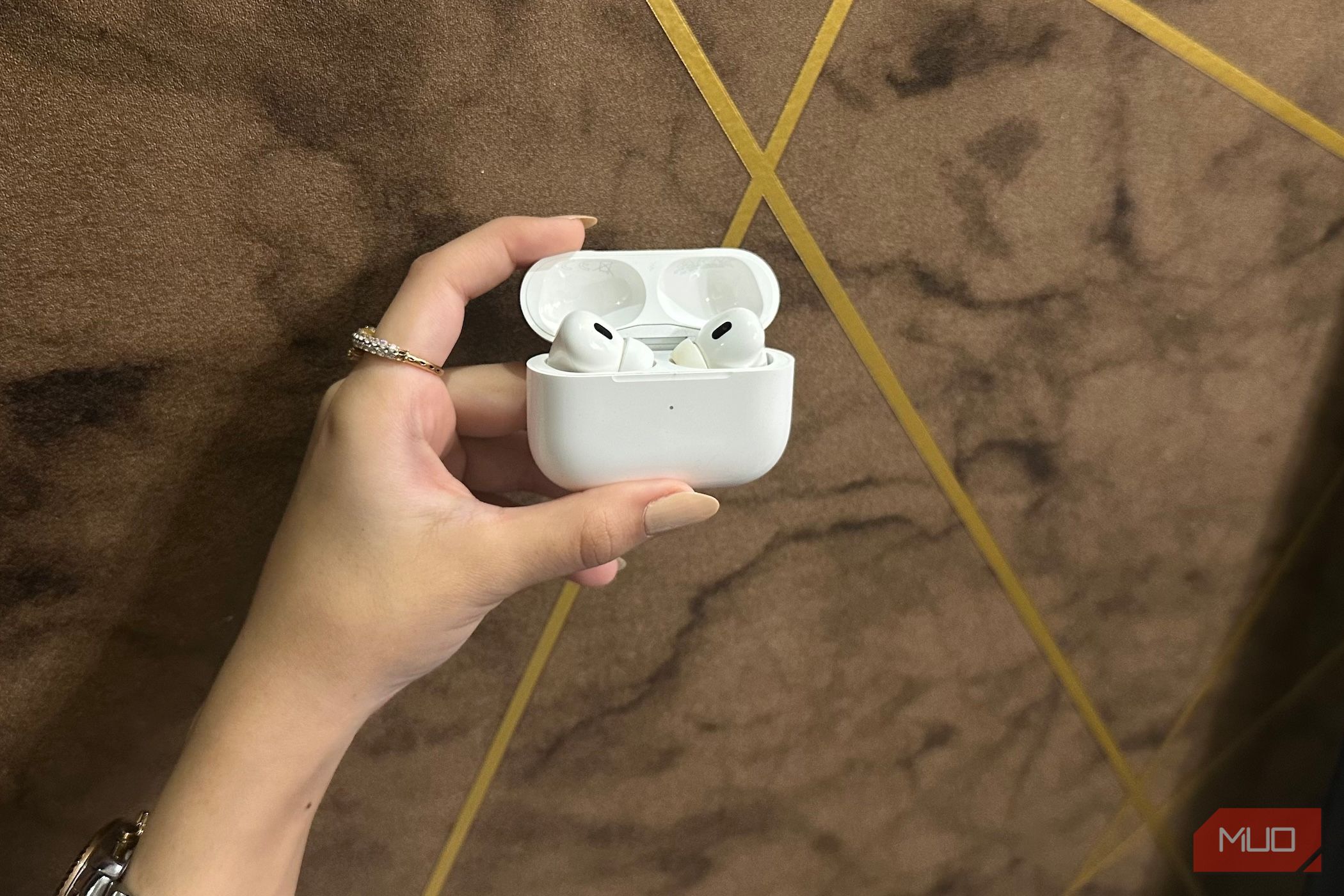 Holding the AirPods Pro 2nd Generation case