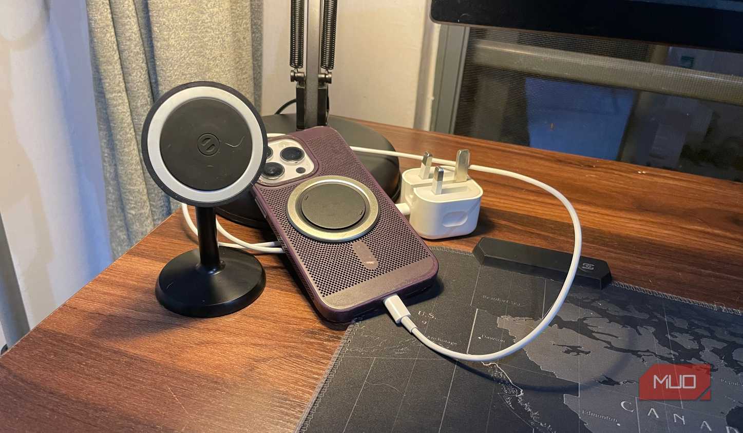 iPhone with a charger and wireless charger