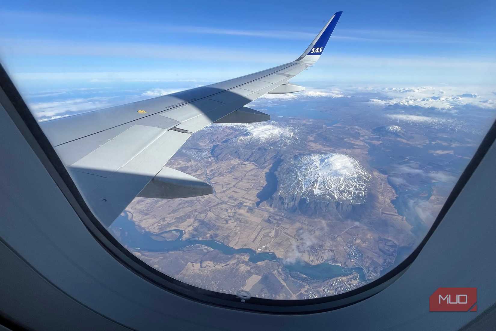 A photo of a plane flying over a landscape