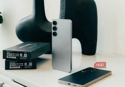 Samsung Galaxy S25 standing up against white mantle.