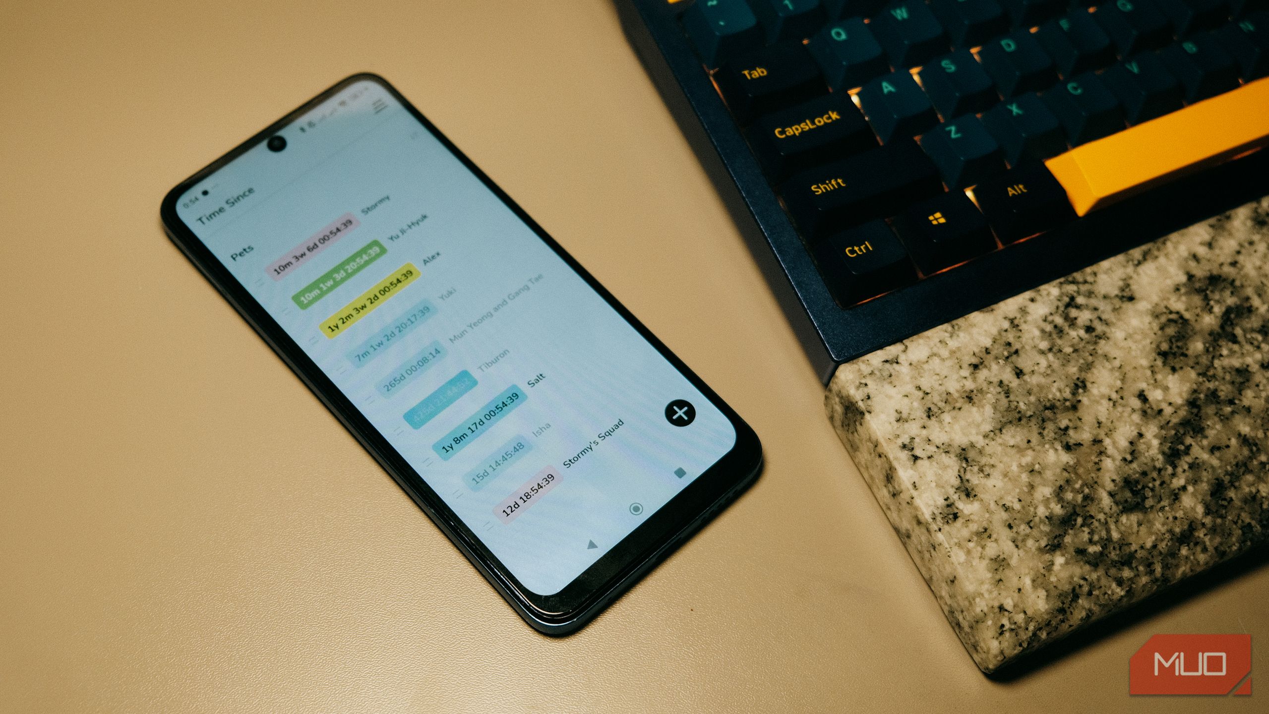 TimeSince on phone beside keyboard