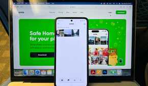 Ente Photos on MacBook with Android Phone Propped on it