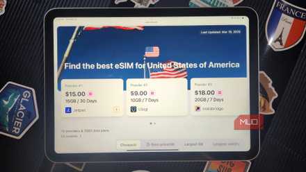 eSIM Website on and iPad with a suitcase.