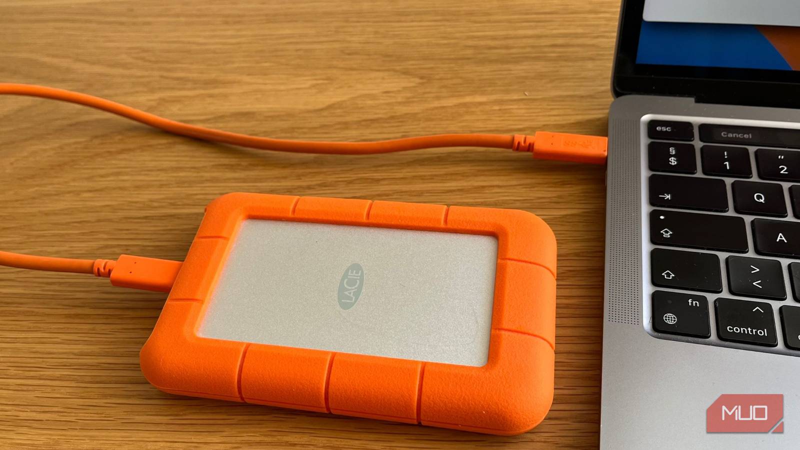 An External Hard Drive Plugged Into a Computer.