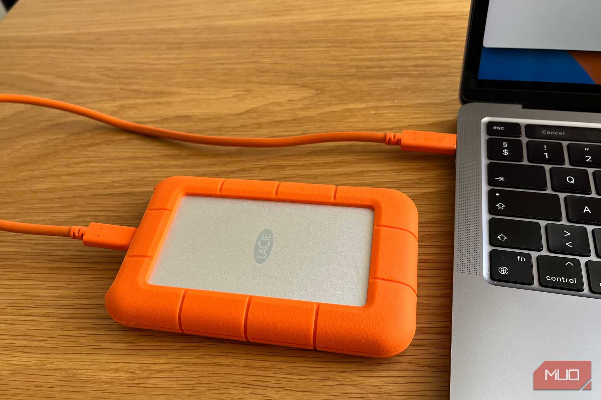 An External Hard Drive Plugged Into a Computer.