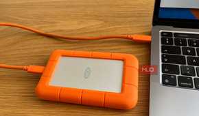 An External Hard Drive Plugged Into a Computer.