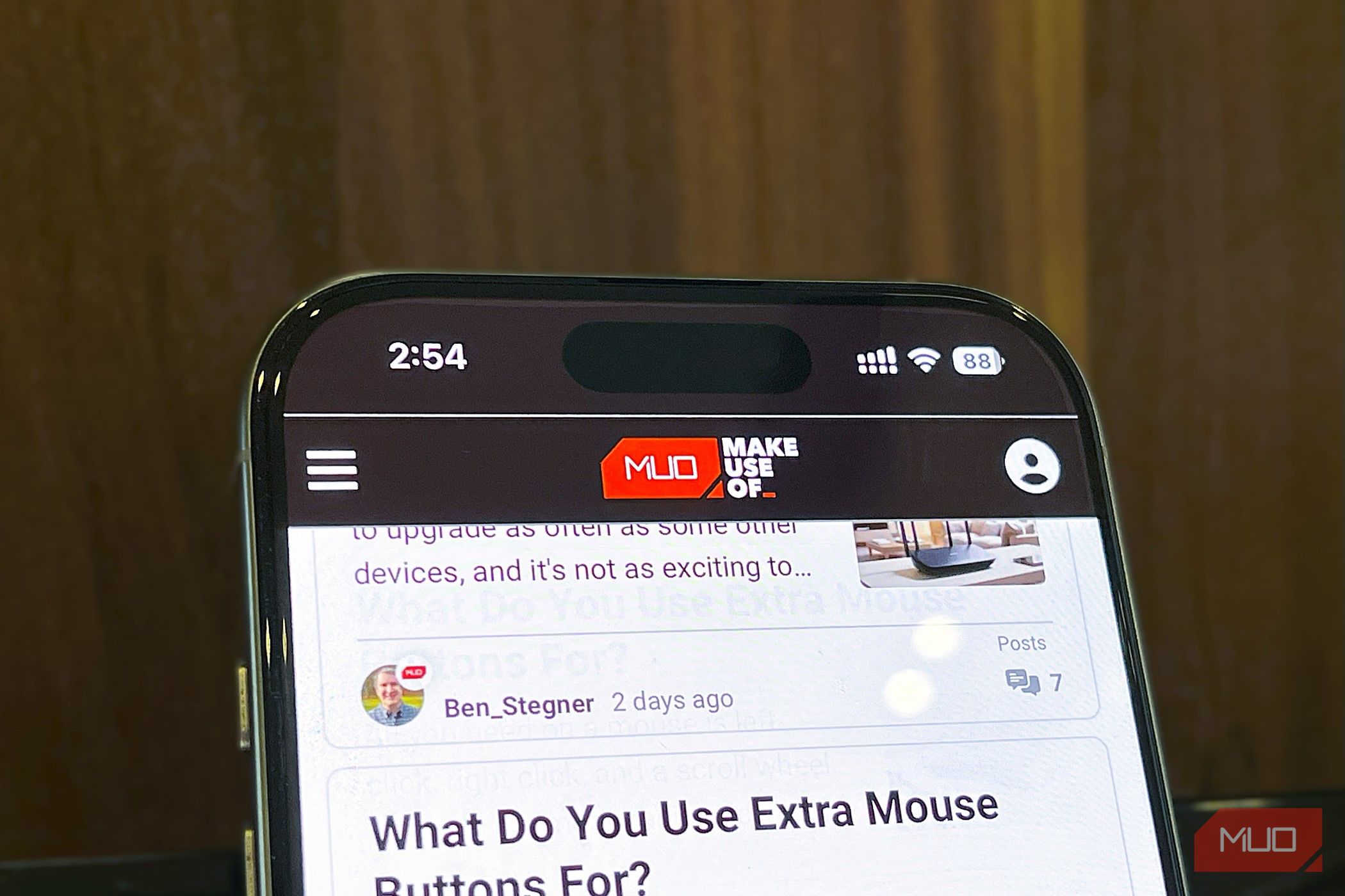iPhone 16 Pro set vertically on a table running Safari