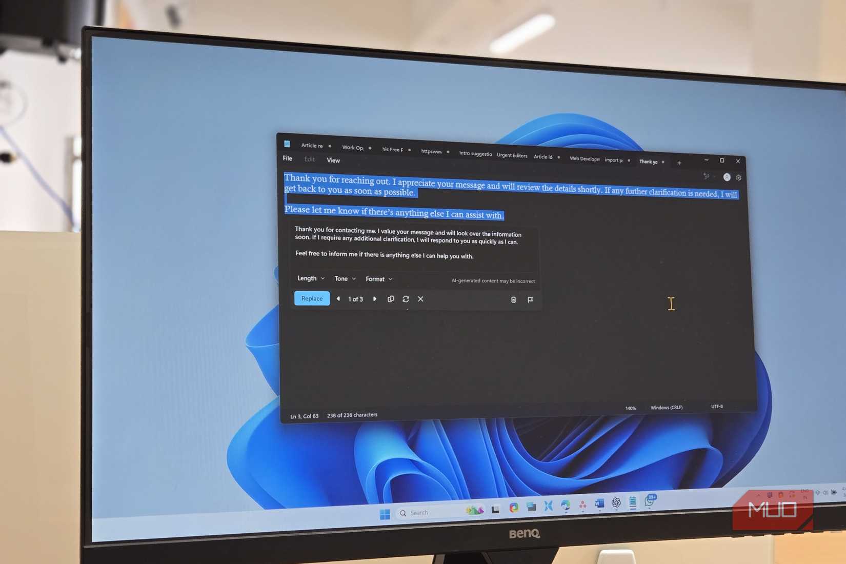 Windows 11 Notepad open on a BENQ monitor
