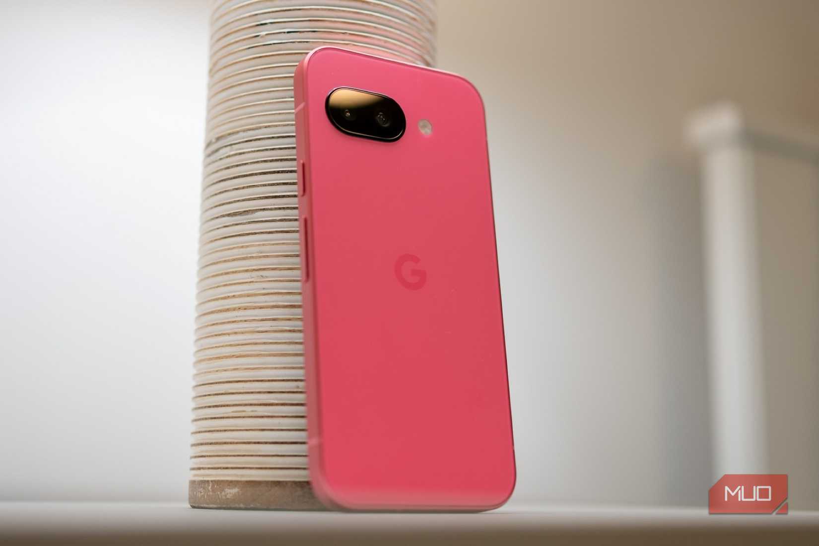 Google Pixel 9a sitting on a table showing the back of the phone
