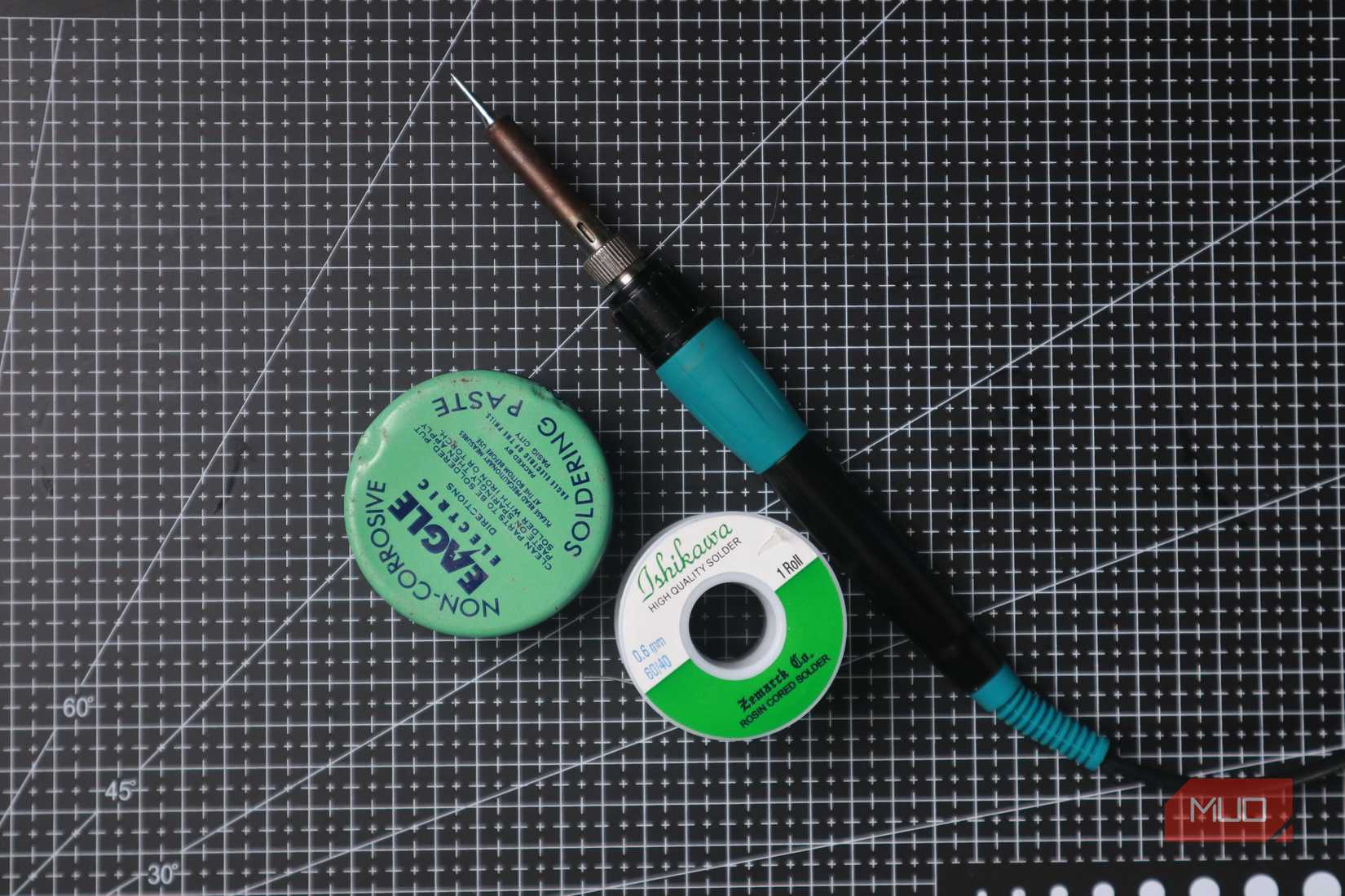 Soldering iron with solder spool and paste.