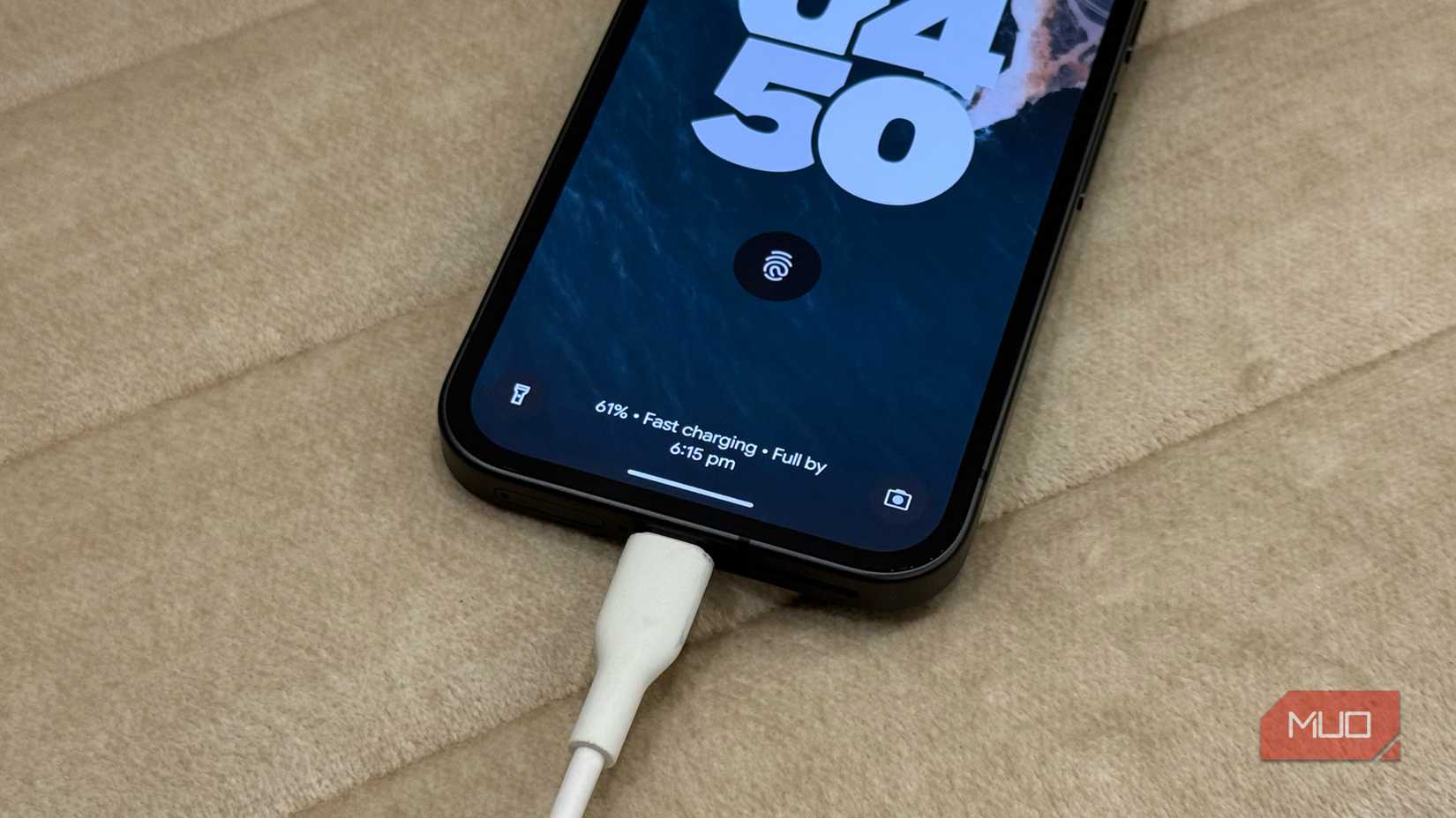 Pixel 9a fast charging on a white sofa