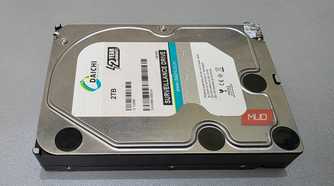 The external hard drive is placed on a desk.