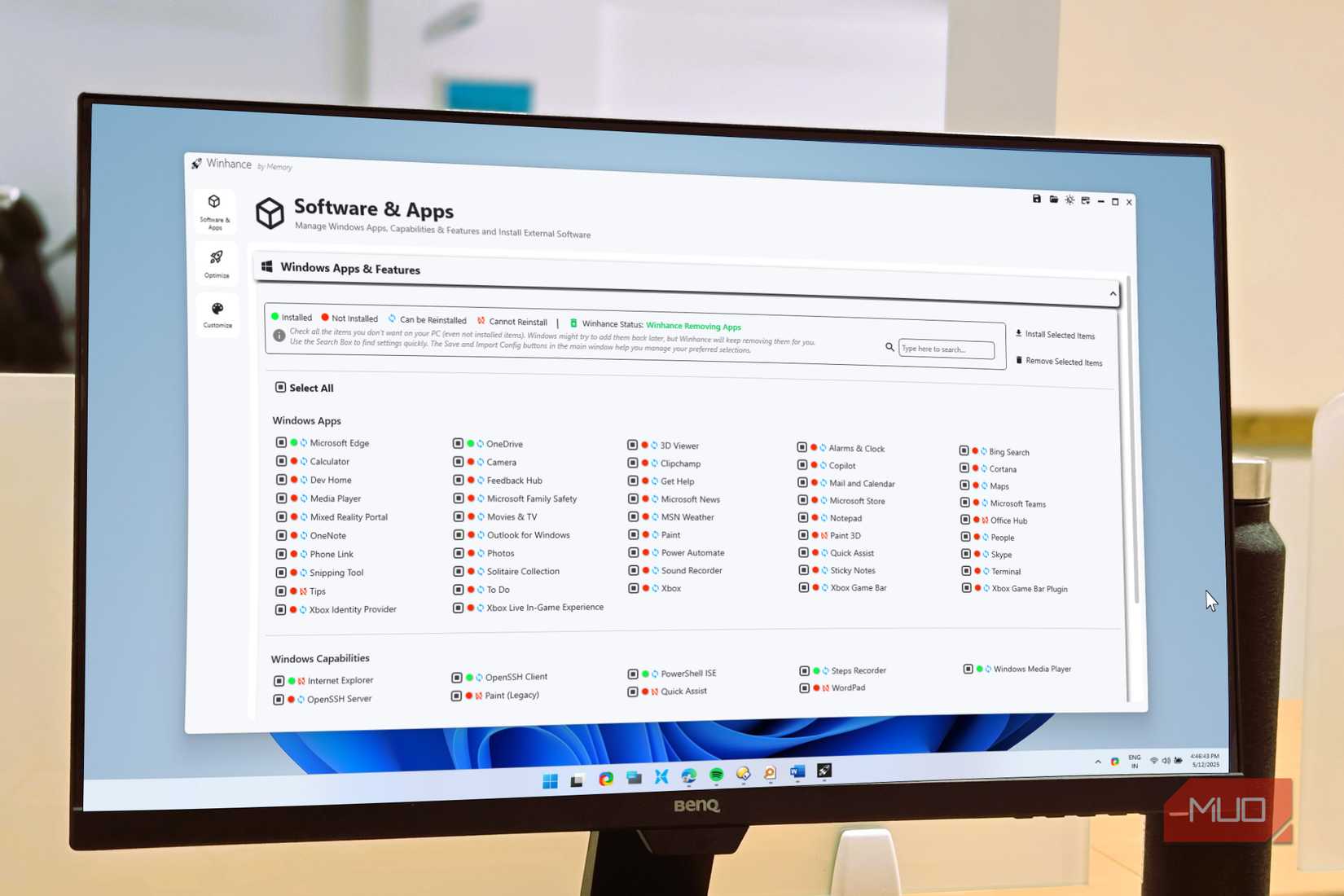 Winhance optimization app open in Windows 11 on a benq monitor