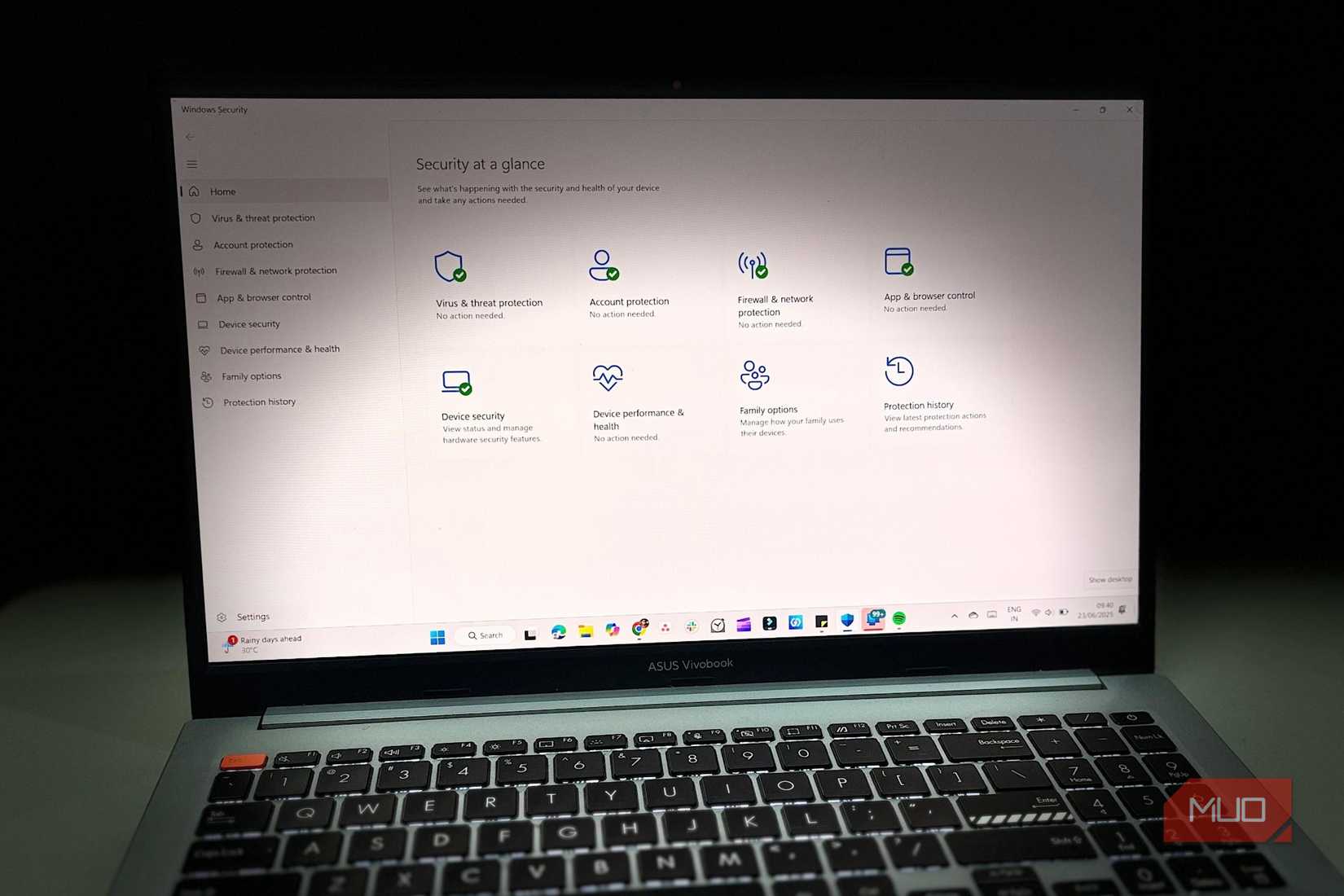 A laptop with Windows Security open is placed on a desk.
