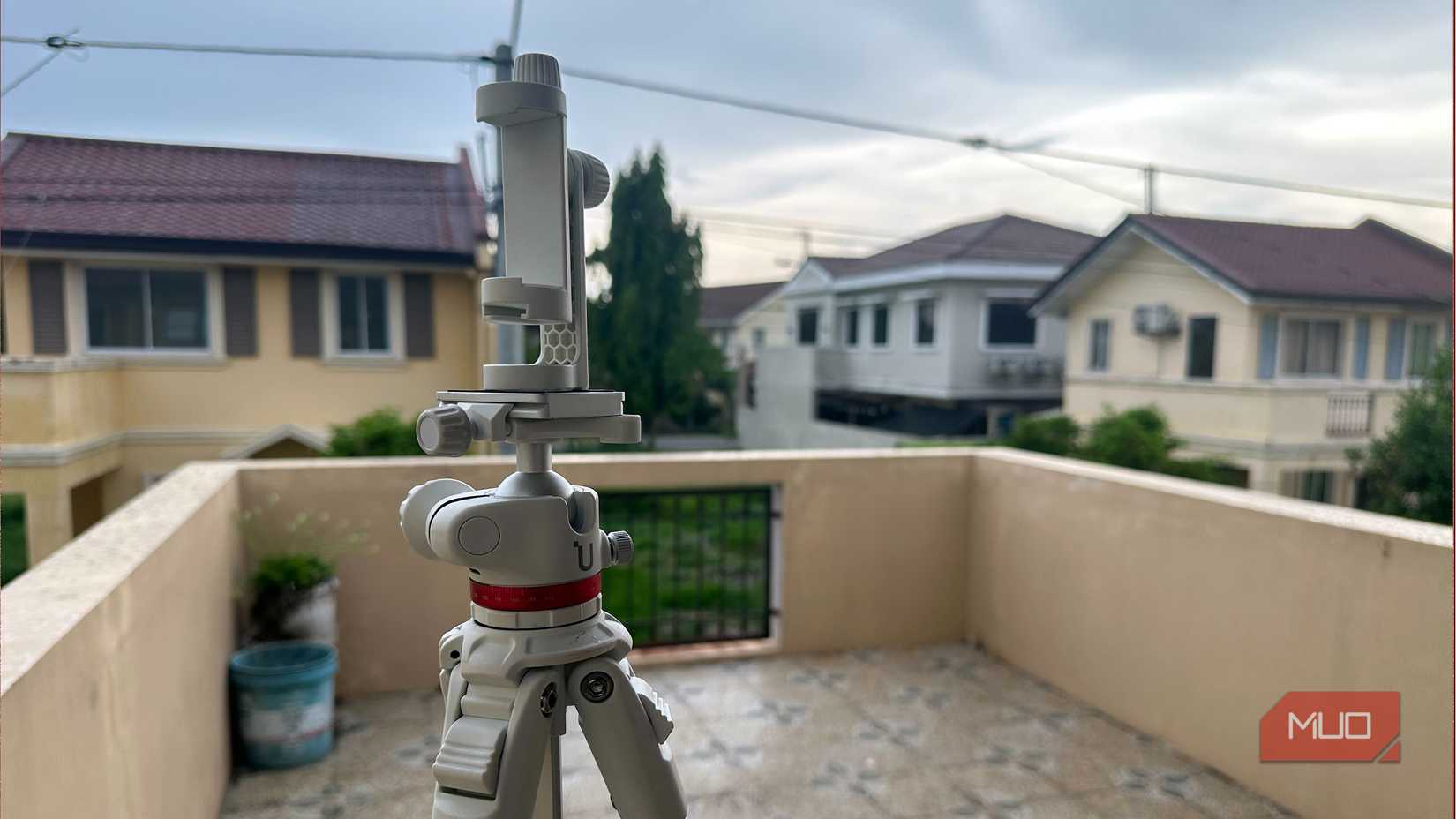 a light-DSLR-grade tripod with a smartphone holder