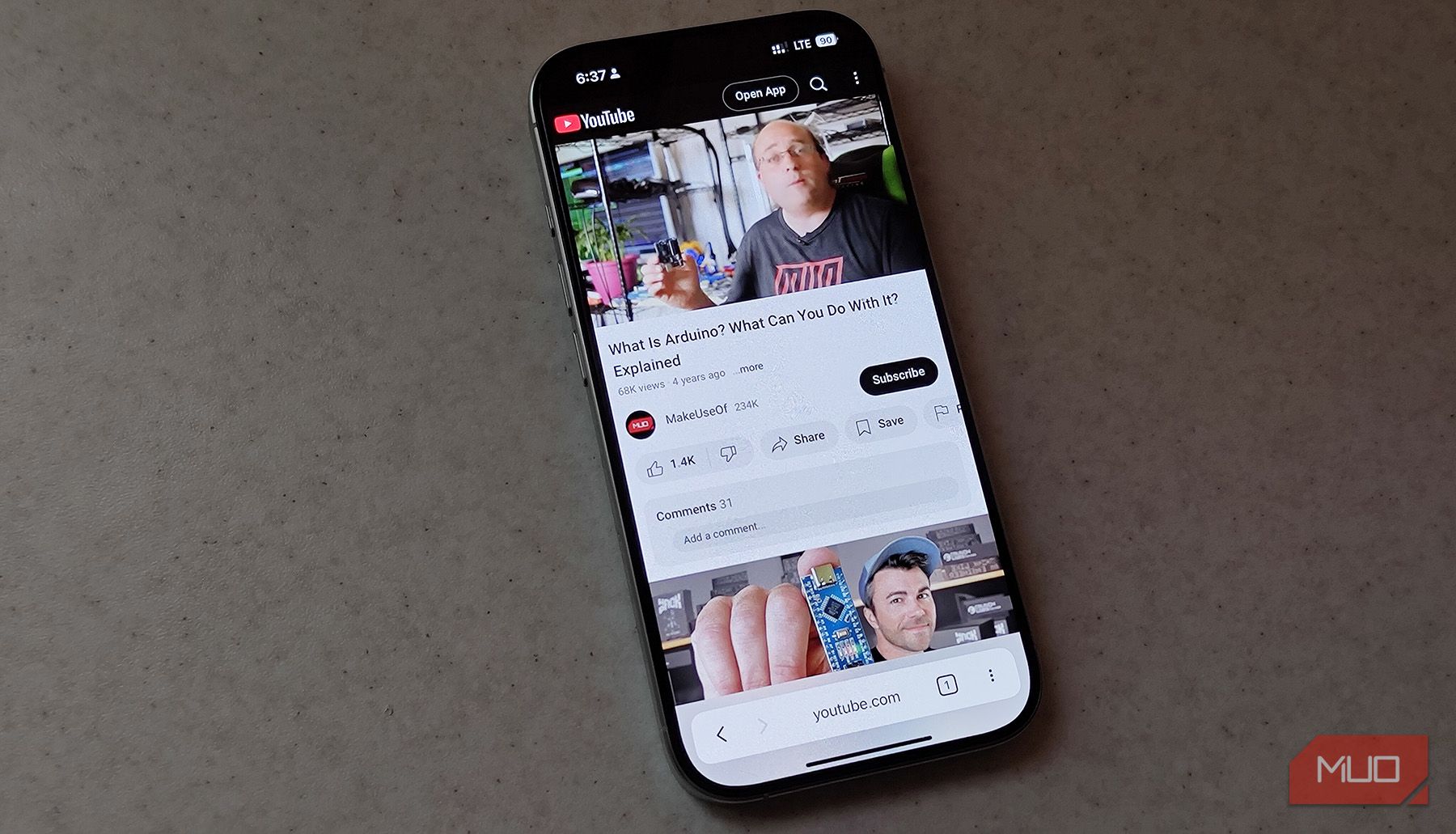 An iPhone with the YouTube web app open