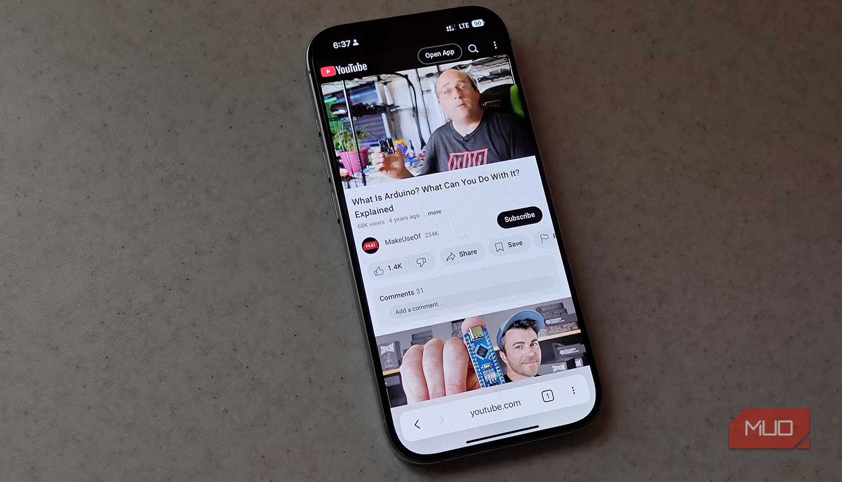 An iPhone with the YouTube web app open
