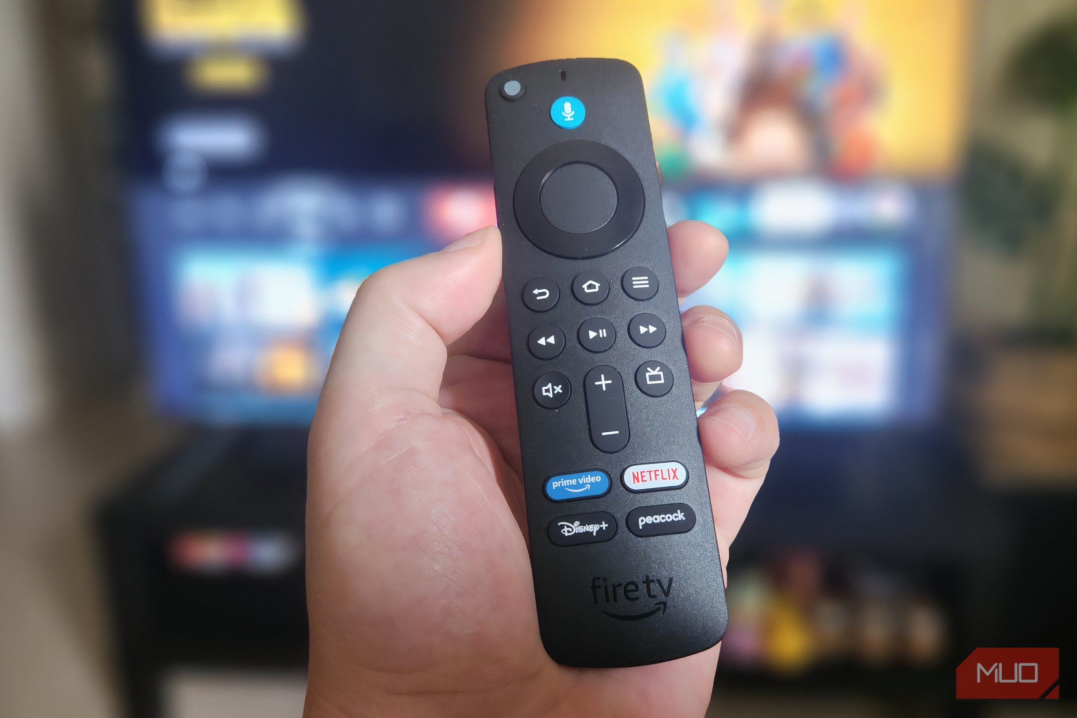 The Fire TV Stick Remote in a hand.