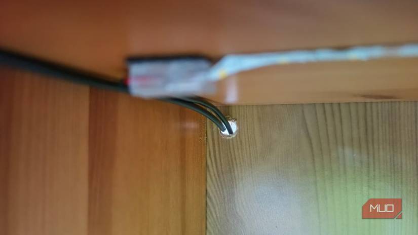 A hole drilled into the back of a display tower