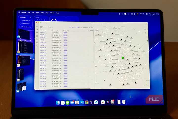 A laptop on a desk showing Obsidian's new Bases feature