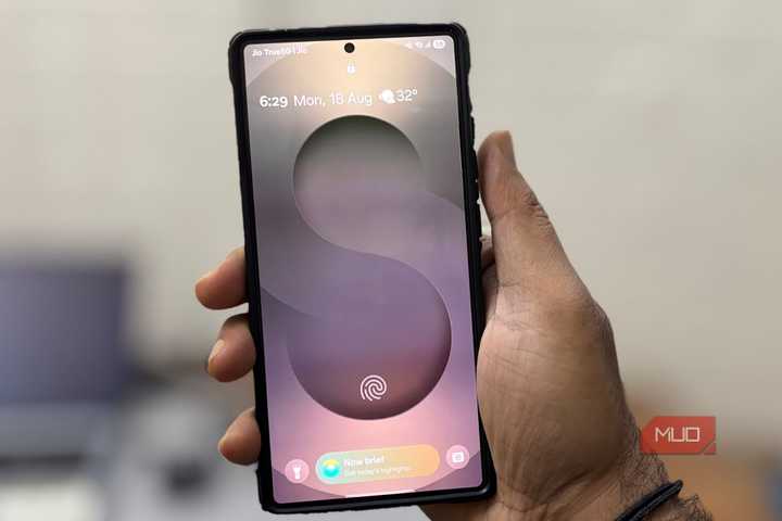 A man holding a Samsung S25 Ultra phone in his hand