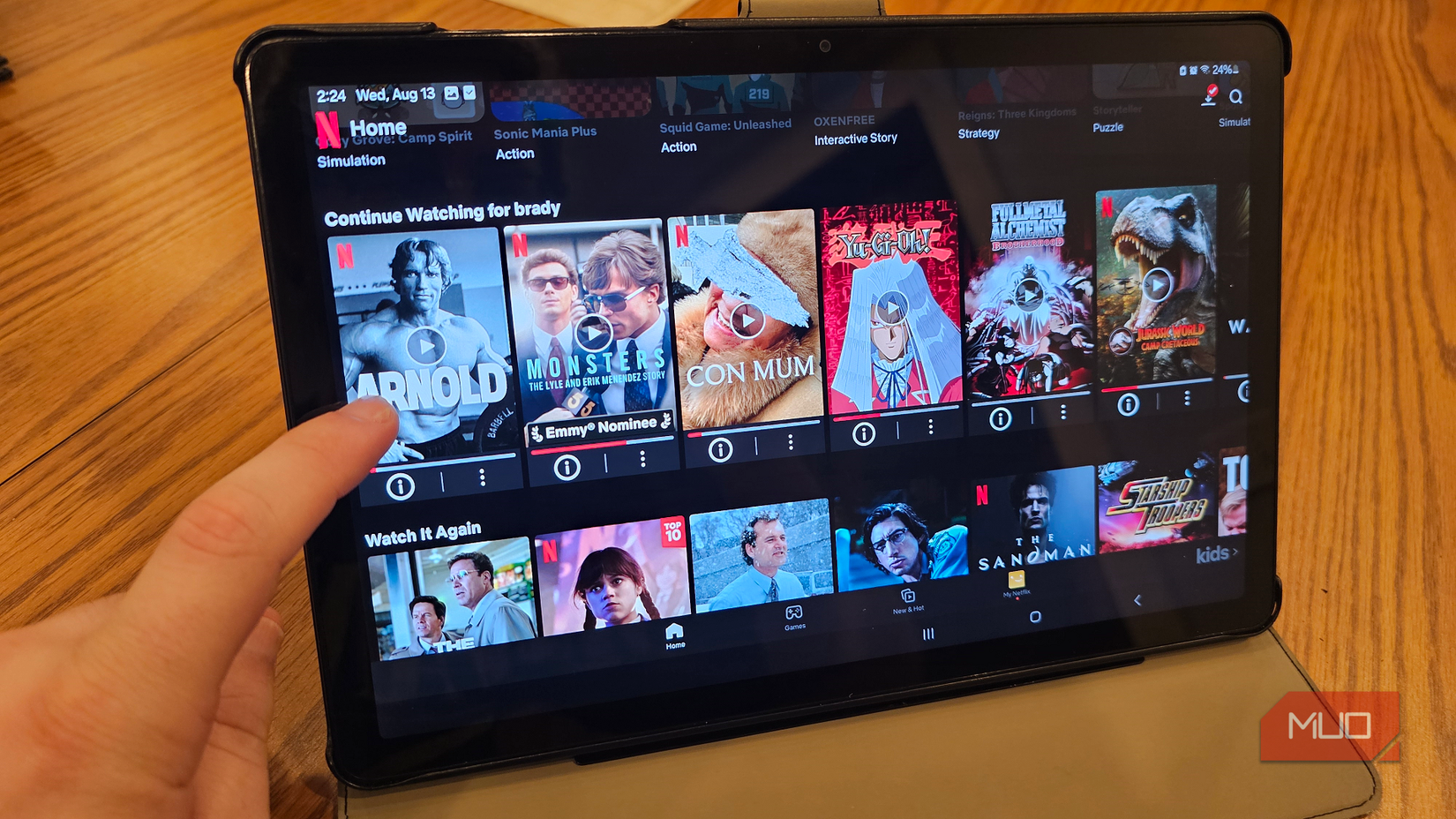 A Samsung tablet opened to Netflix, with rows of available content, which include Arnold and Monsters