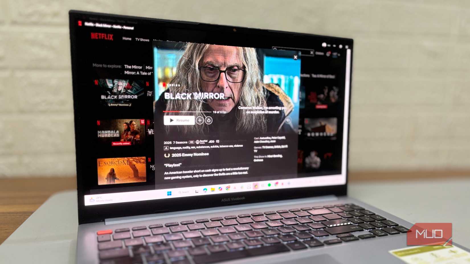 A Windows laptop is playing Black Mirror on Netflix