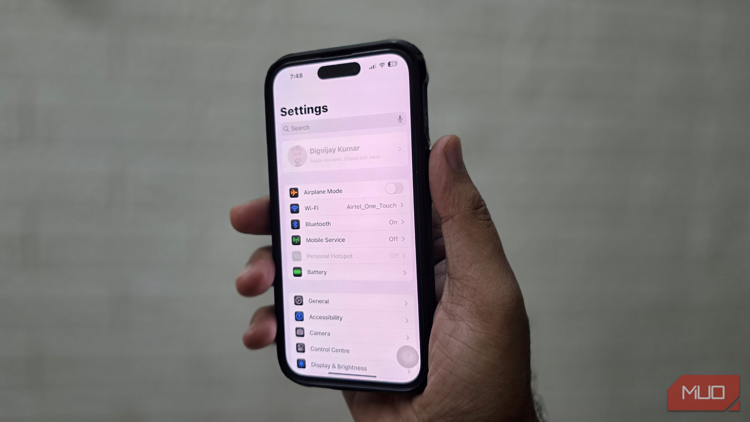 An iPhone is shown with the account section grayed out in the settings menu