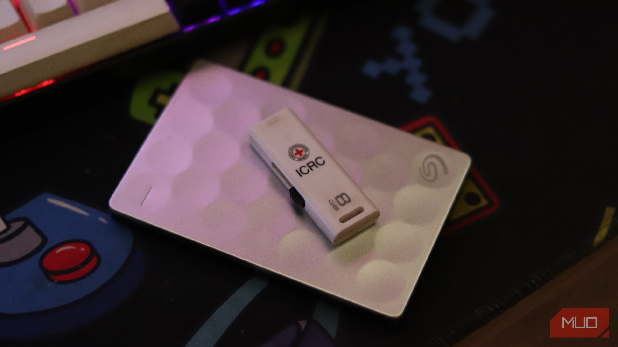 External SSD and USB drive on a mousepad