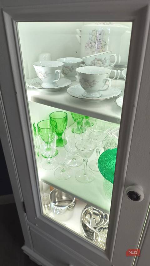 Full view of an illuminated China cabinet