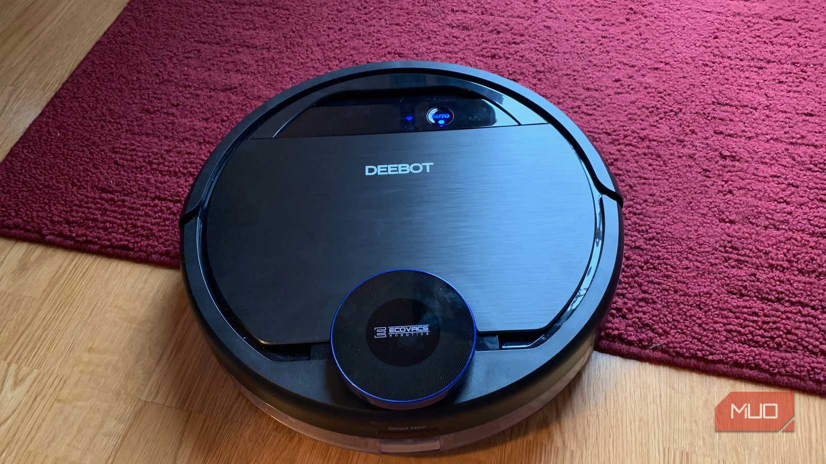 A robot vacuum near carpet.