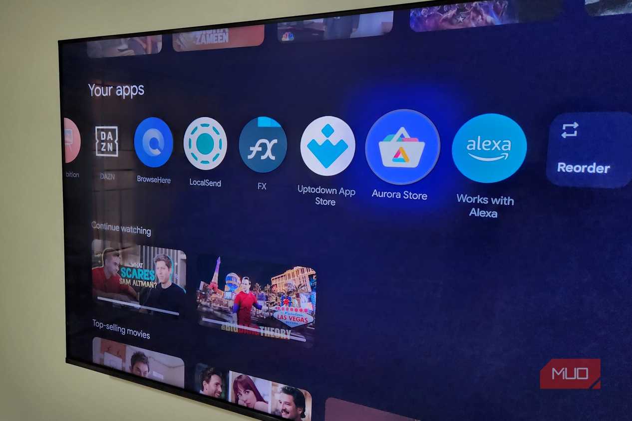 TCL Google TV on wall showing apps on home screen